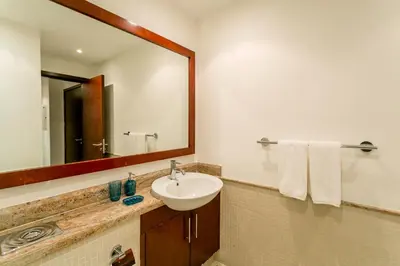a bathroom with a sink and a mirror at La Dolce Vita in Dubai