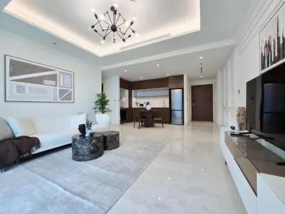 a living room with a couch and a television at Luxury Sea View Palace Beach Residence by Emaar in Dubai
