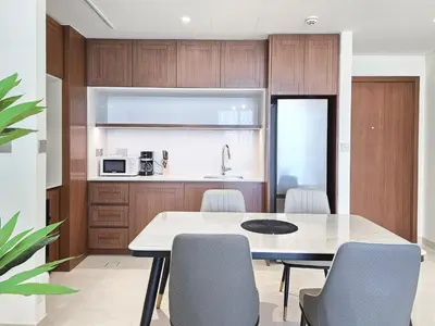 a kitchen and dining room with a table and chairs at Luxury Sea View Palace Beach Residence by Emaar in Dubai