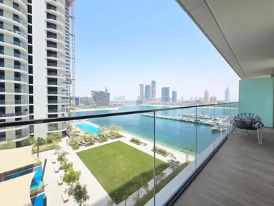 a view of the water from the balcony of a building at Luxury Sea View Palace Beach Residence by Emaar in Dubai