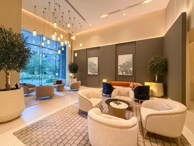 a lobby with couches and chairs and a table at 18 Vida Dubai Mall Newly Furnished 1 bedroom in Dubai