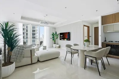 a living room with a couch and a table at Luxury Branded Suite with Direct Private Beach Access & Sea Views in Dubai