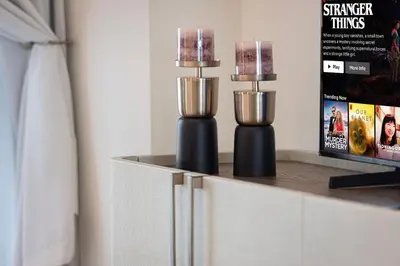 two candles sitting on top of a counter in a room at Luxury Studio with Private Jacuzzi in Business Bay in Dubai