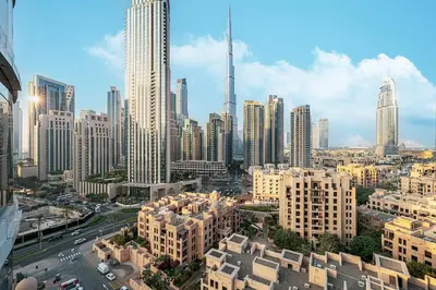 a view of a large city with tall buildings at 3BR with Burj Khalifa View - Pool - Gym - Downtown in Dubai
