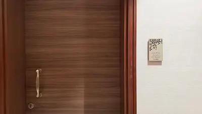 a wooden door with a sign on it at 3BR with Burj Khalifa View - Pool - Gym - Downtown in Dubai