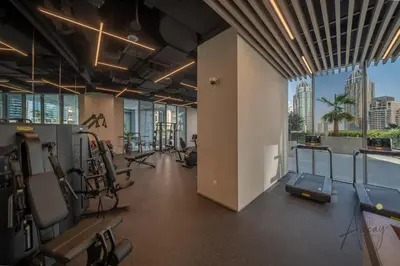 a gym with cardio equipment and a view of the city at Luxe Desiged Stu Dubai Marina Dream LIV Marina in Dubai