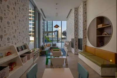 a childrens waiting room with a couch and chairs at Luxe Desiged Stu Dubai Marina Dream LIV Marina in Dubai