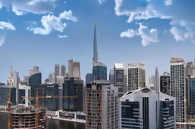 a view of a large city with skyscrapers at Burj Khalifa View Luxe 1BR Paragon by IGO in Dubai