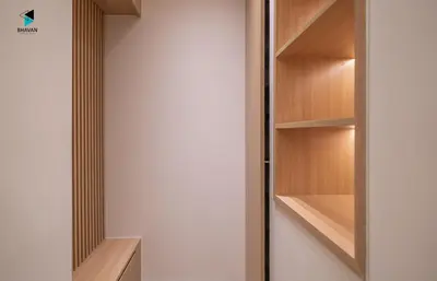 a walk in closet with wooden shelves at Modern Marina-View 3 BR Prime Waterfront in Dubai