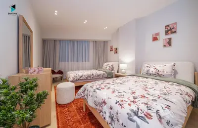 a bedroom with two beds and a mirror at Modern Marina-View 3 BR Prime Waterfront in Dubai