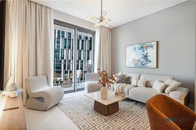 a living room with a couch and a table at Ritz 1BR Vida Dubai Mall Hotel Amenity & Mall Access in Dubai