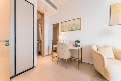 a living room with a table and chairs and a couch at Direct Beachfront Access, Connected to Address Beach Resort, Unmatched Walkability Near Cafes, Restaurants and Retail shops - Jumeirah Gate Tower, JBR by Deluxe Holiday Homes in Dubai