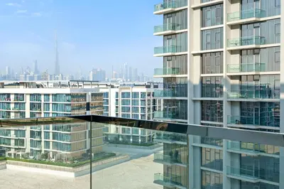 a view of a tall building from a window at Cozy 1BR at D1 Residence 13 with Stunning City View in Dubai
