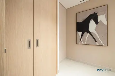 a room with a painting of a horse on the wall at Posh 2BR Vida Dubai Mall Hotel Amenity & Mall Access in Dubai