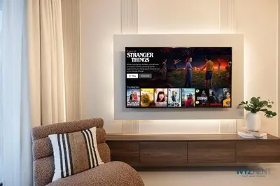 a living room with a tv on a wall at Posh 2BR Vida Dubai Mall Hotel Amenity & Mall Access in Dubai