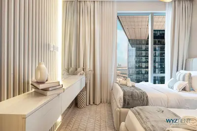 a hotel room with two beds and a large window at Posh 2BR Vida Dubai Mall Hotel Amenity & Mall Access in Dubai
