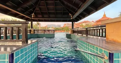 a pool at a resort with water in it at 1BR Apartment Anantara Palm Private Beach in Dubai