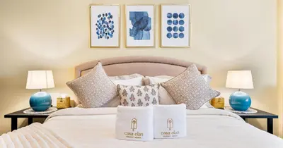 a bedroom with a bed with pillows on it at 1BR Apartment Anantara Palm Private Beach in Dubai