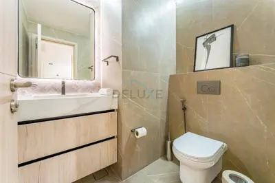 a bathroom with a toilet and a sink and a mirror at Full Yacht Harbour and Marina Canal Views, Walking Distance to Tram Station and Beach - Shemara W2, Dubai Marina by Deluxe Holiday Homes in Dubai