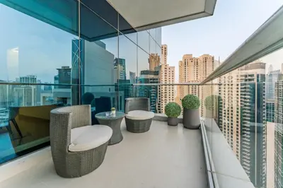 a balcony with a view of a city at Full Yacht Harbour and Marina Canal Views, Walking Distance to Tram Station and Beach - Shemara W2, Dubai Marina by Deluxe Holiday Homes in Dubai