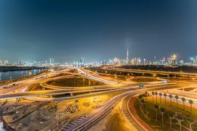an overhead view of a city with traffic at night at Full Burj Khalifa and Dubai Canal views, Minutes from Downtown and Dubai Mall - Farhad Azizi Residence, Al Jaddaf by Deluxe Holiday Homes in Dubai