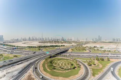 an overhead view of a highway with a city in the background at Full Burj Khalifa and Dubai Canal views, Minutes from Downtown and Dubai Mall - Farhad Azizi Residence, Al Jaddaf by Deluxe Holiday Homes in Dubai