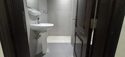a bathroom with a sink and a toilet in it at Peaceful Apartments in Dubai