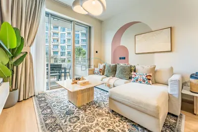 a living room with a couch and a table at Walk from Burj Khalifa and Dubai Mall, and Conveniently Located near the Metro Station - BD Standpoint A, Downtown by Deluxe Holiday Homes in Dubai