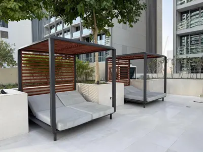 two gazebos sitting on a patio in a city at Sterling West House in Dubai