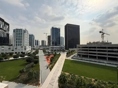 a view of a city with tall buildings at Canal View Studio AG Tower in Dubai