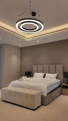 a bedroom with a large bed with a large circular ceiling at World Class 6 BDR Villa In Signature Palm in Dubai