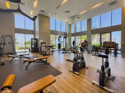 a gym with lots of exercise equipment in a building at StayShort - Luxury 1 Bedroom Apartment in Dubai Marina Sleeps 4 in Dubai