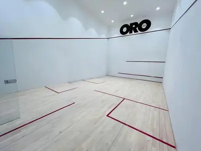 an empty room with a basketball court with red lines on the floor at HAVN - 1 bedroom in Torino, Al Barsha in Dubai