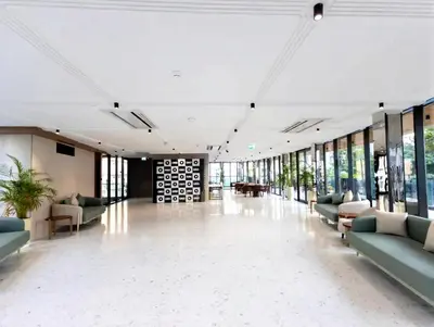 a lobby with couches and tables in a building at HAVN - 1 bedroom in Torino, Al Barsha in Dubai