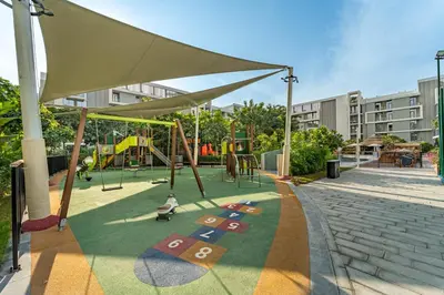 a park with a playground with a swing at HAVN - 1 bedroom in Torino, Al Barsha in Dubai