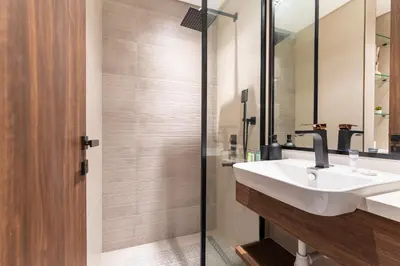 a bathroom with a sink and a shower at HAVN - 1 bedroom in Torino, Al Barsha in Dubai