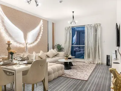 a living room with a couch and a table at Downtown Dubai 1BR - 2BR Full Burj Khalifa View in Dubai