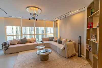 a living room with a couch and a table at 3BR apartment in the one of the tallest tower in Marina in Dubai