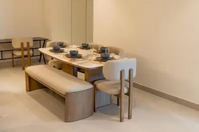 a dining room with a table and chairs at 3BR apartment in the one of the tallest tower in Marina in Dubai