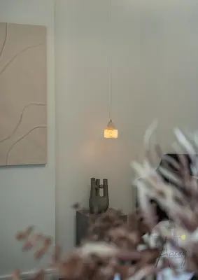 a blurry picture of a room with a table with a lamp at Luxury Modern 1BR Paragon by Igo Downtown 1BR in Dubai