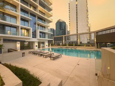 a swimming pool in the middle of a building at Luxury 1BR Paragon by IGO BURJ khalifa View in Dubai