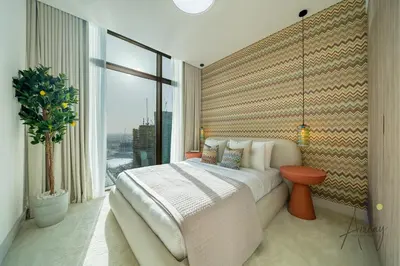 a bedroom with a large bed and a large window at Luxe Missoni-Inspired 1BR Sky-High Living in Dubai