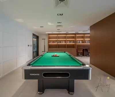 a billiard room with a pool table at Upscale 1BR Paragon by IGO Near Downtown in Dubai
