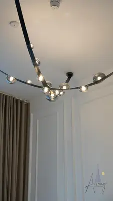 a track light on the ceiling of a room at Upscale 1BR Paragon by IGO Near Downtown in Dubai