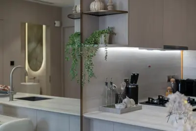 a kitchen with a sink and a counter with plants at Urban Oasis 1BR Designer Nest Chic & Cosy in Dubai