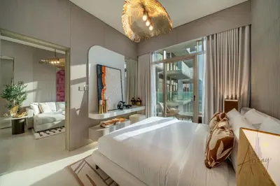 a bedroom with a large white bed and a mirror at Boutique 1BR Escape Cosy & Classy JVC in Dubai