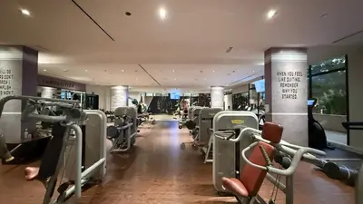 a gym with rows of treadmills and machines at Luxe Royal Amwaj Palm Jumeirah Beach Access in Dubai