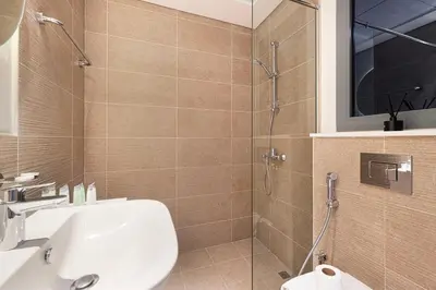 a bathroom with a sink and a shower at Swanky Studio with Balcony in Dubai Hills Estate in Dubai