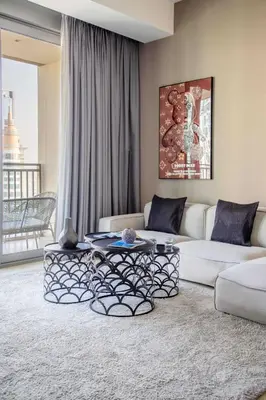a living room with a couch and a table at Frank Porter - 5242 Emaar Tower in Dubai