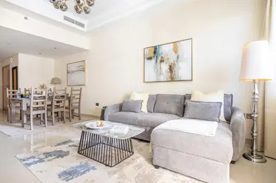 a living room with a couch and a table at Frank Porter - Ocean Heights, Dubai Marina in Dubai
